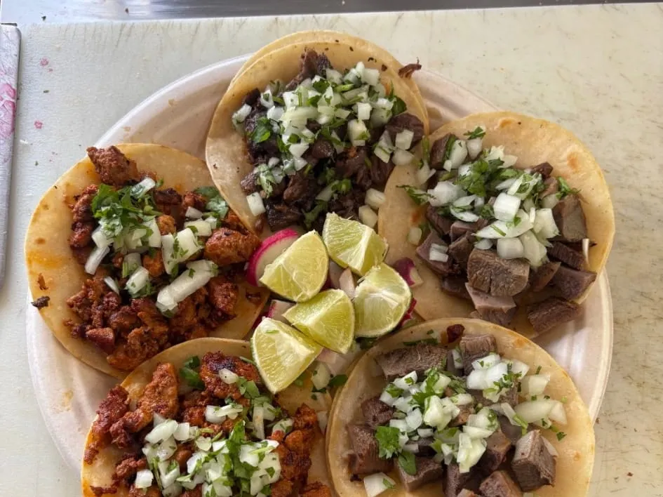 Street tacos with onion, cilantro, and lime